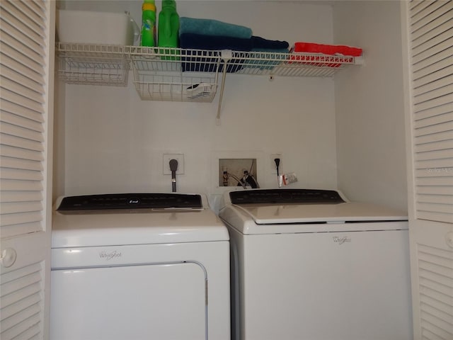 laundry area featuring washing machine and clothes dryer