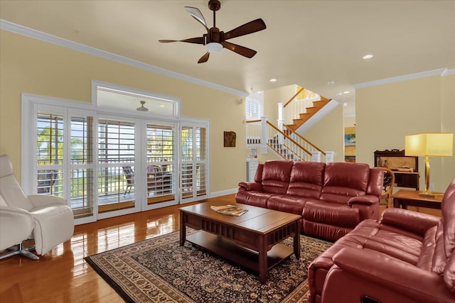 living room featuring ceiling fan, hardwood / wood-style floors, and ornamental molding