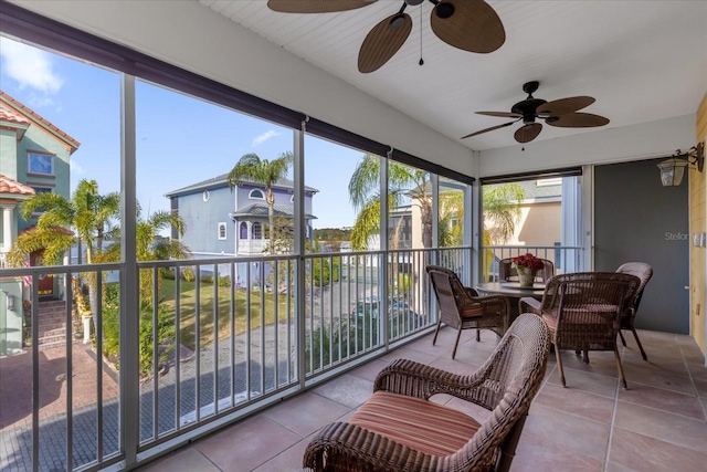 sunroom / solarium with ceiling fan