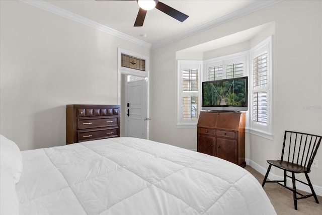 bedroom featuring ceiling fan, light colored carpet, and crown molding