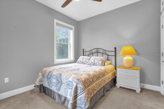 bedroom with ceiling fan and light colored carpet