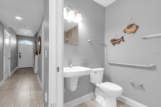 bathroom featuring tile patterned flooring and toilet