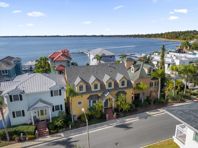 birds eye view of property featuring a water view