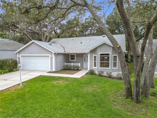 ranch-style house featuring a garage and a front lawn