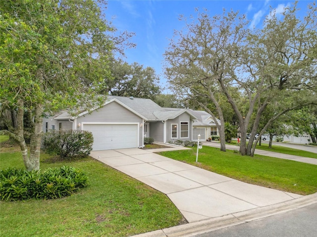 ranch-style house featuring a garage and a front lawn