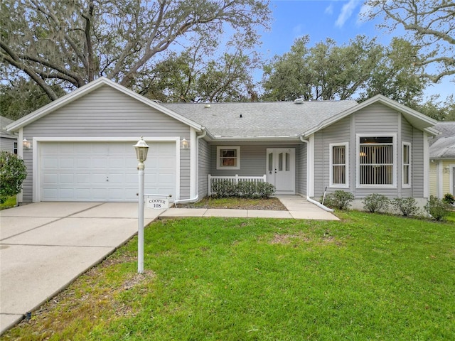 single story home with a porch, a garage, and a front yard