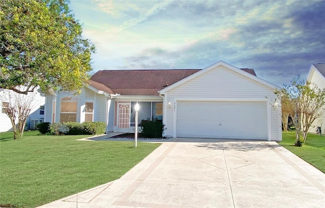 single story home featuring a front yard and a garage