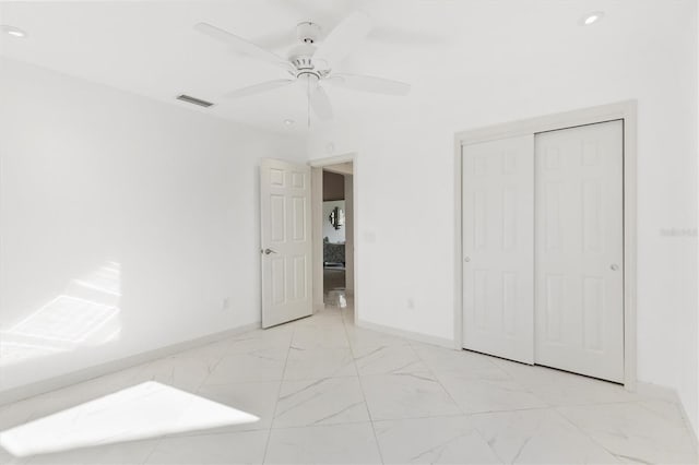 unfurnished bedroom featuring a closet and ceiling fan