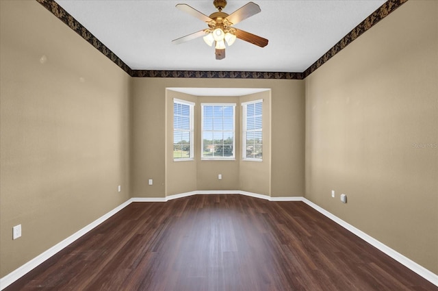 spare room featuring ceiling fan and wood-type flooring