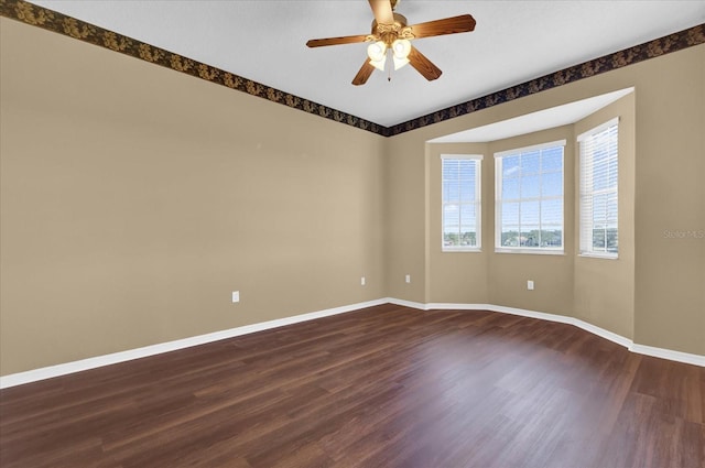 empty room with ceiling fan and wood-type flooring