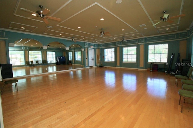 interior space with light hardwood / wood-style floors and crown molding