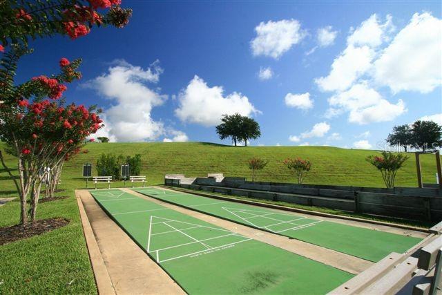 view of home's community with a yard and a rural view