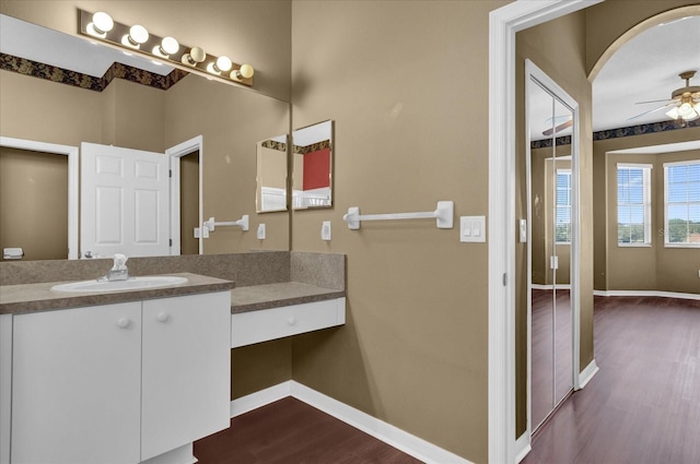 1063 Mesa Verde Ct, Clermont, FL 34711 - bathroom with baseboards, ceiling fan, wood finished floors, and vanity