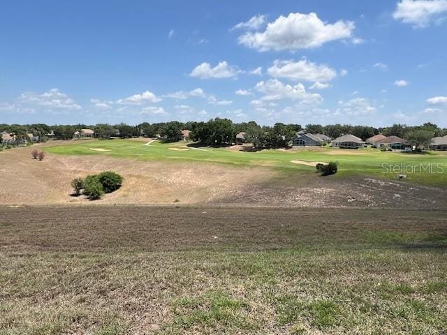 1063 Mesa Verde Ct, Clermont, FL 34711 - view of community with a lawn and golf course view