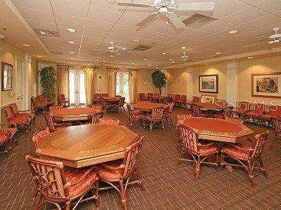 1063 Mesa Verde Ct, Clermont, FL 34711 - dining area with ceiling fan and carpet flooring