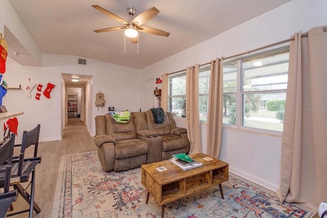 living room with ceiling fan and light hardwood / wood-style floors