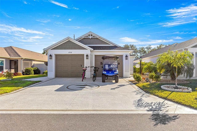 view of front of home featuring a front lawn and a garage