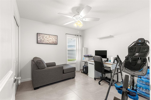 office featuring a textured ceiling and ceiling fan