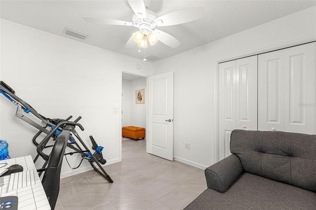 workout room with ceiling fan