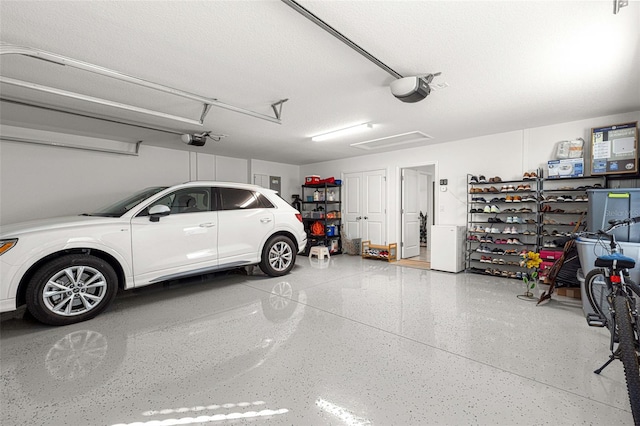 garage featuring a garage door opener