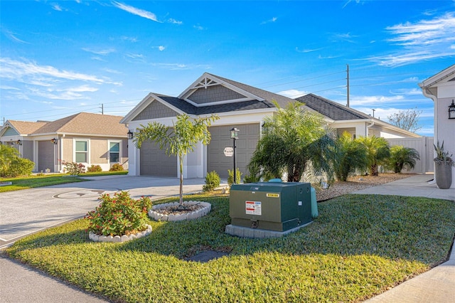 view of front of property featuring a garage and a front yard