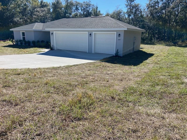 garage featuring a lawn