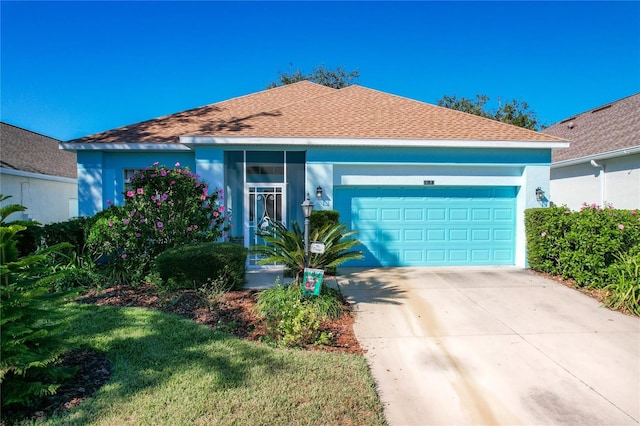 ranch-style house featuring a garage