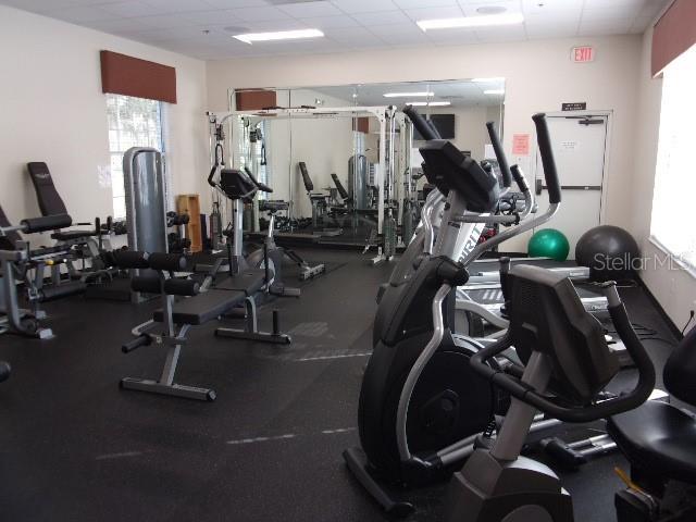 gym featuring a drop ceiling