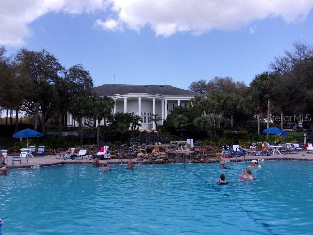 view of pool with a water view