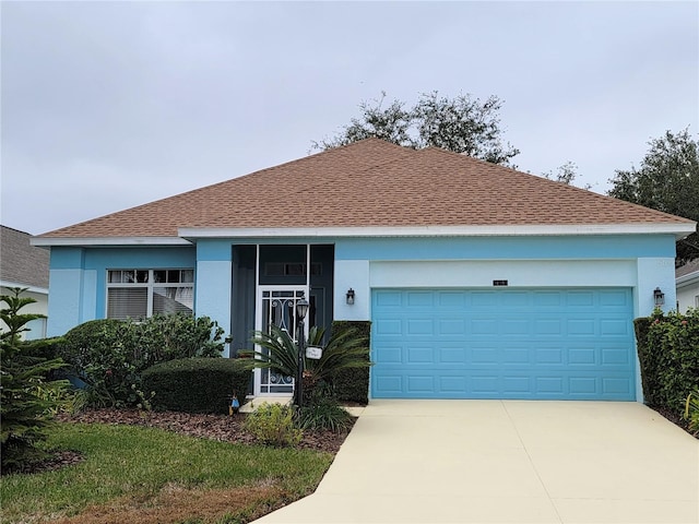 single story home featuring a garage