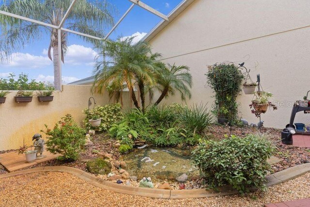 view of yard featuring a lanai