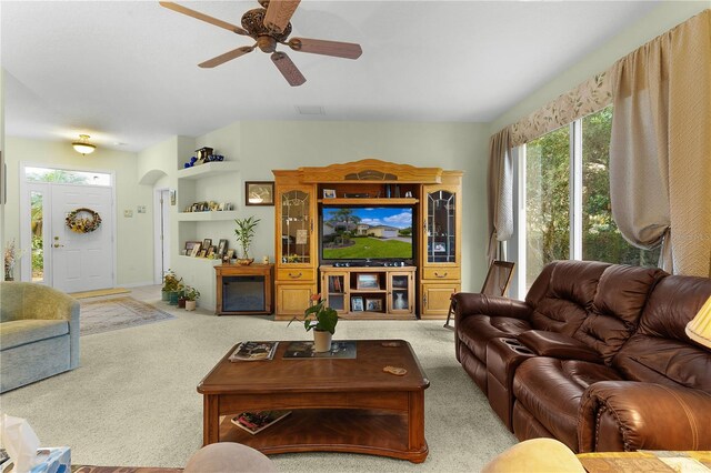 living room with ceiling fan and light carpet