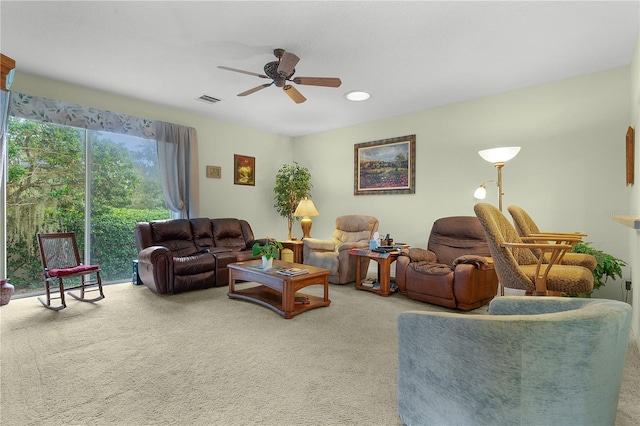 living room with ceiling fan and carpet floors