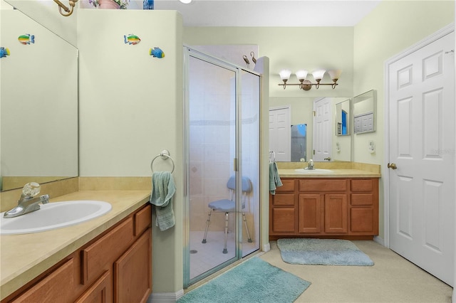 bathroom featuring vanity and an enclosed shower