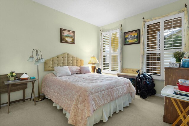 bedroom with light colored carpet