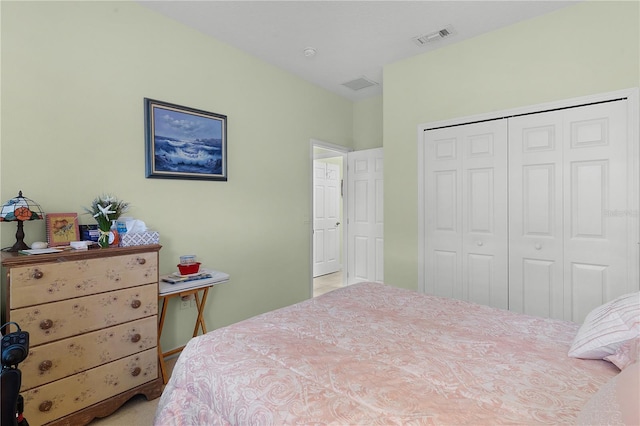 carpeted bedroom with a closet