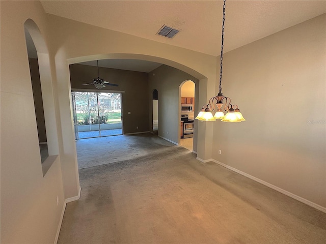 interior space featuring carpet flooring, a textured ceiling, and ceiling fan with notable chandelier