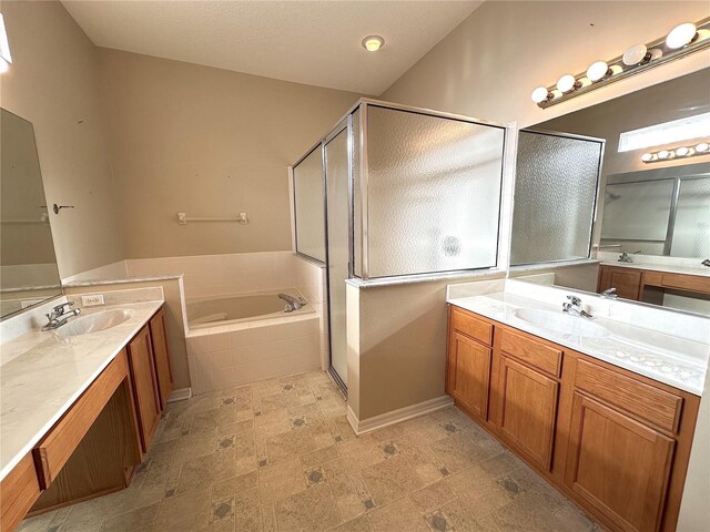 bathroom featuring vanity and plus walk in shower