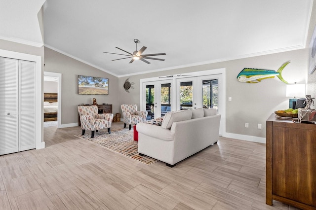 living room featuring french doors, ornamental molding, ceiling fan, and lofted ceiling