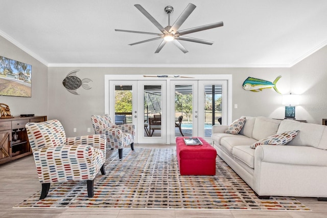 living room featuring french doors, light hardwood / wood-style floors, ceiling fan, and ornamental molding