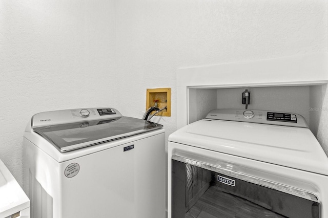 laundry room featuring separate washer and dryer