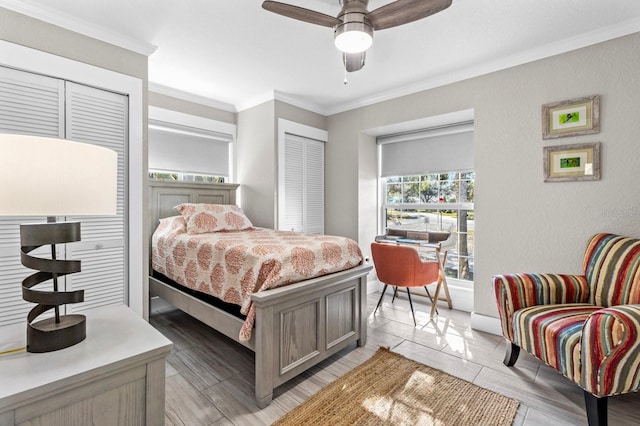 bedroom featuring ceiling fan, crown molding, and a closet