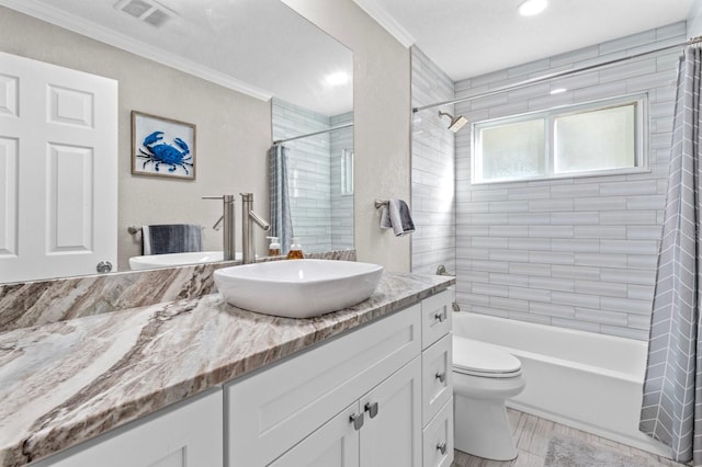 full bathroom featuring vanity, toilet, ornamental molding, and shower / tub combo with curtain