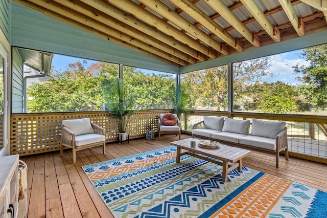 sunroom featuring lofted ceiling