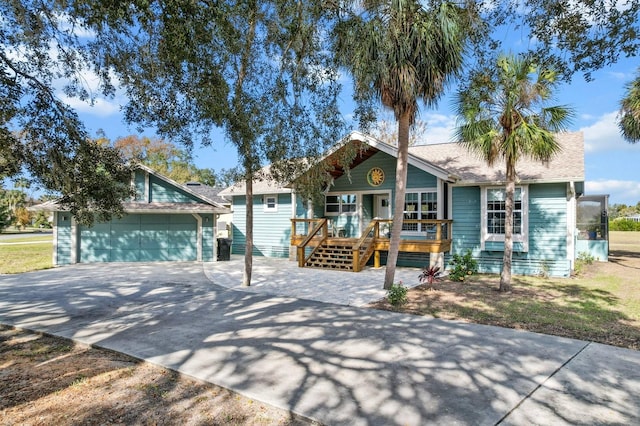 view of front of property with a porch and a garage