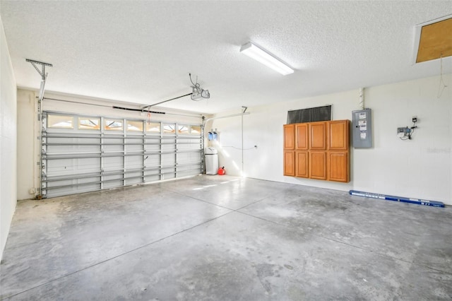 garage with electric panel and a garage door opener