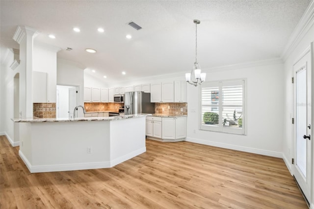 kitchen with kitchen peninsula, appliances with stainless steel finishes, light hardwood / wood-style floors, and white cabinetry