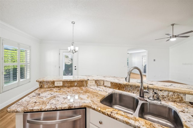 kitchen with stainless steel dishwasher, crown molding, sink, and light hardwood / wood-style flooring