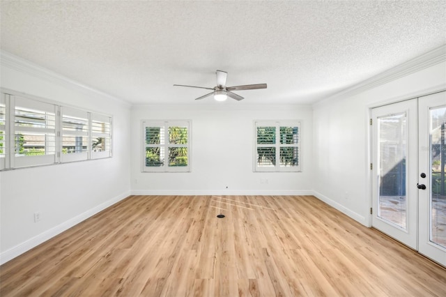 spare room featuring french doors, a textured ceiling, light hardwood / wood-style floors, and ceiling fan