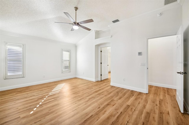 unfurnished room with ceiling fan, crown molding, light wood-type flooring, and a textured ceiling